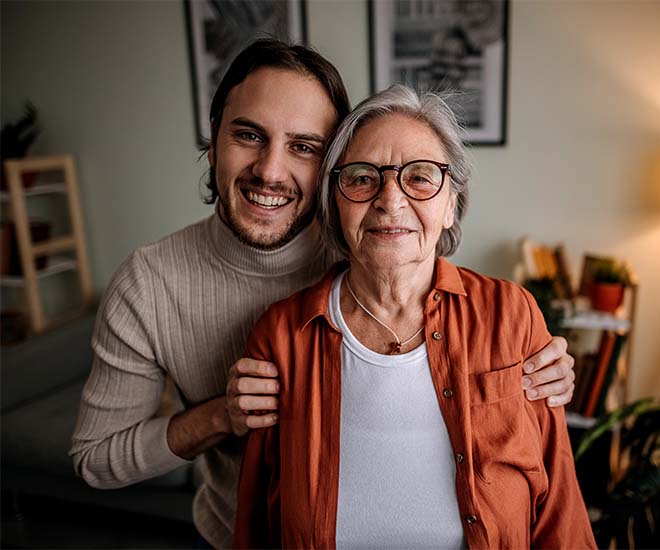 Son smiling with his mother who has Dementia