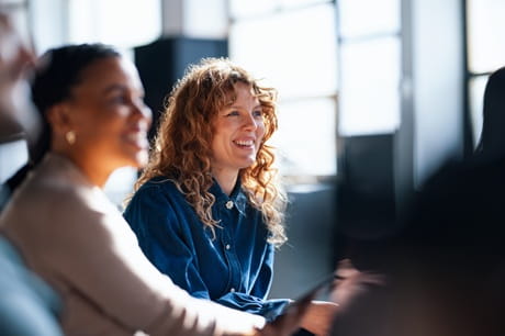 2 Federal employees looking at their benefits online