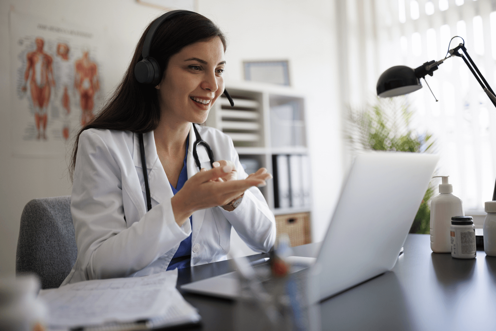 A doctor chats with someone on a video call