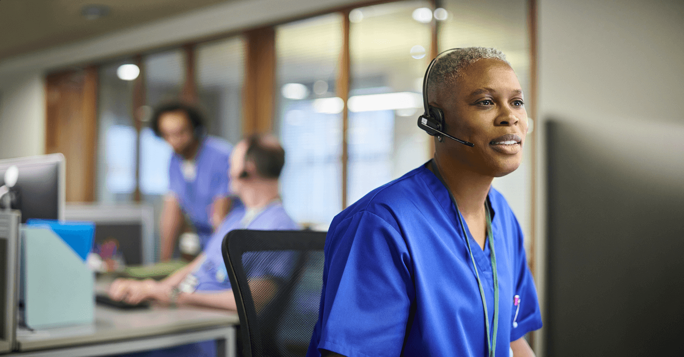A nurse takes a telehealth call