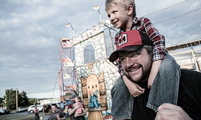 father and son at an amusement park 