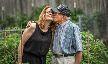 Two seniors kiss