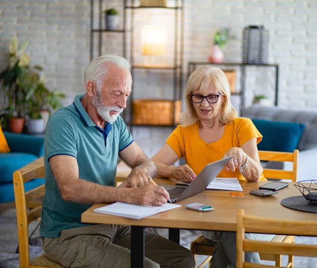 Retired couple shopping for insurance online