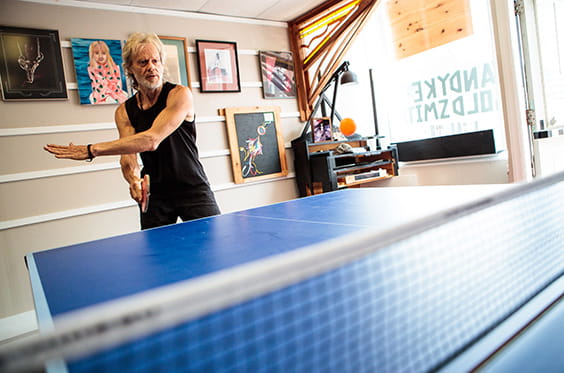 65+ man playing ping pong