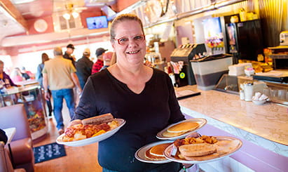 A woman checks her diabetes monitor