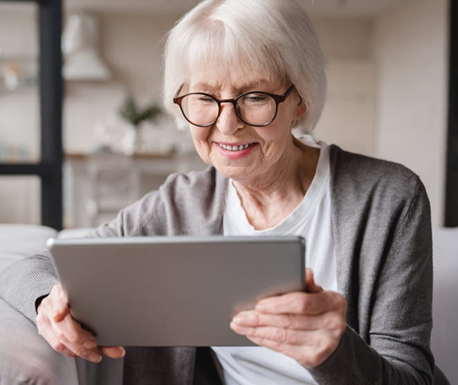 senior looking at ipad