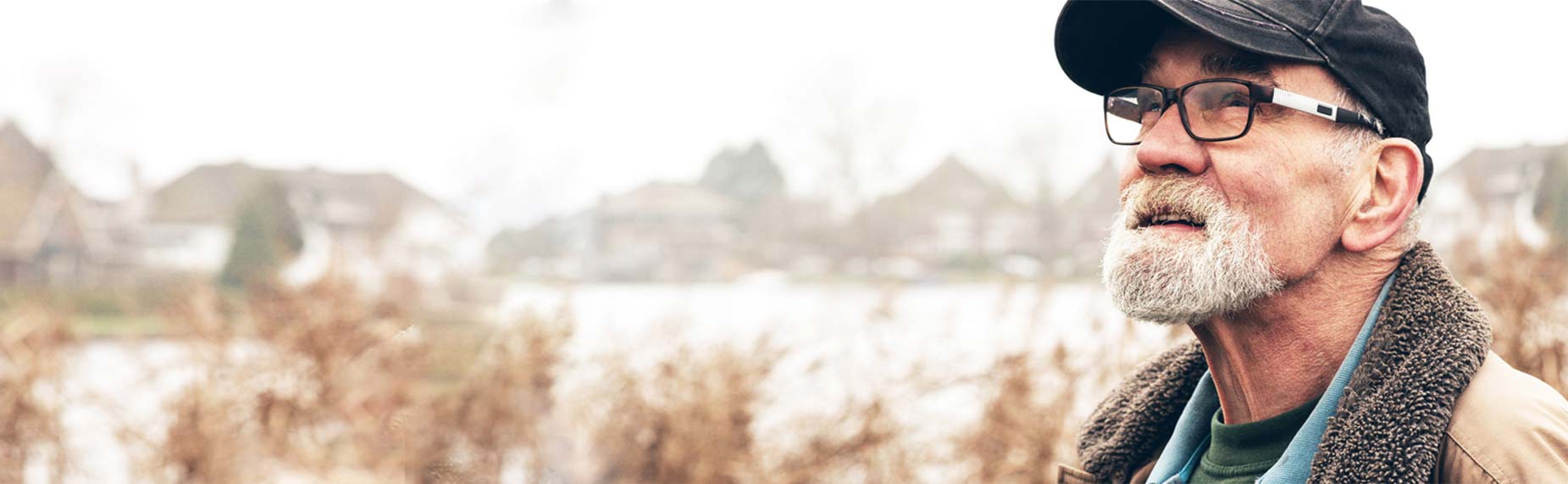 Man with a black cap looking to the left