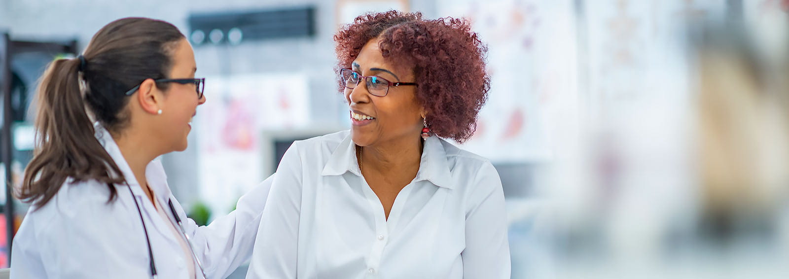 physician consulting female patient regarding type 1 diabetes diagnosis