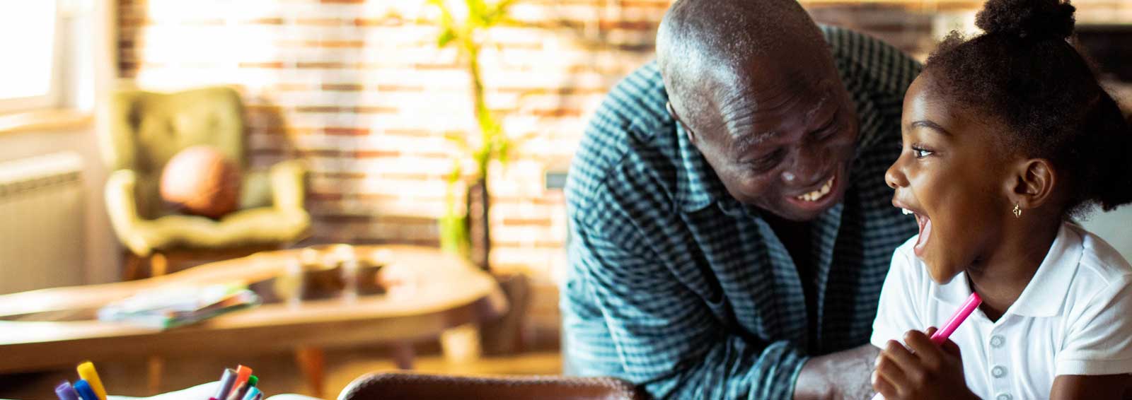Grandfather with epilepsy enjoying time with granddaughter.