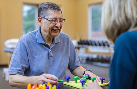 A man and woman in occupational therapy