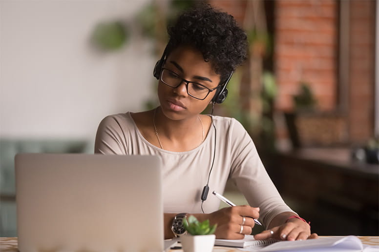 Female sitting down at a computer