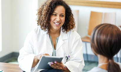 A psychiatrist meets with a mental health patient to prescribe medication.
