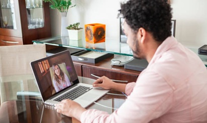 A young man receives mental health care via telehealth.