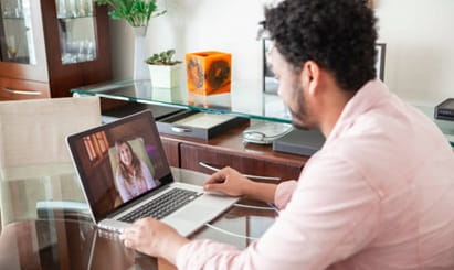 A young man receives mental health care via telehealth.
