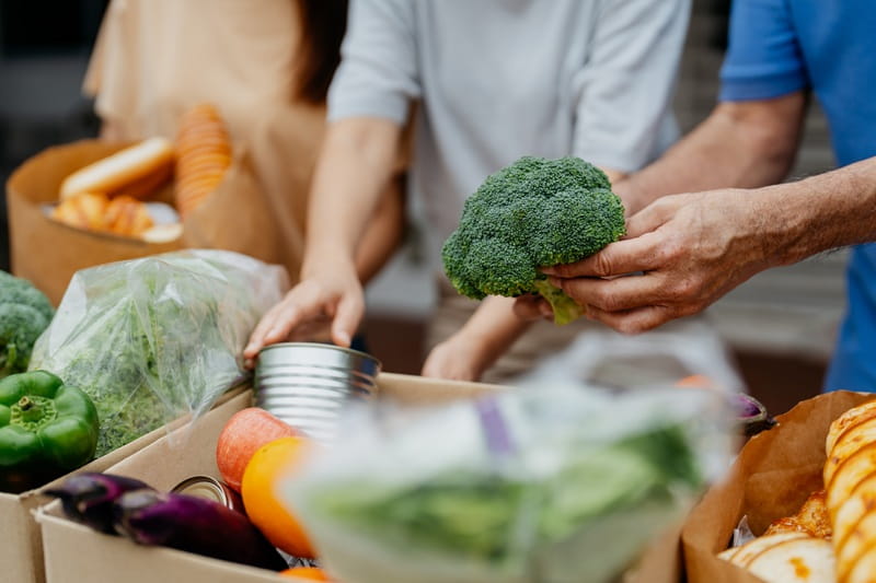 People preparing vegetables to eat