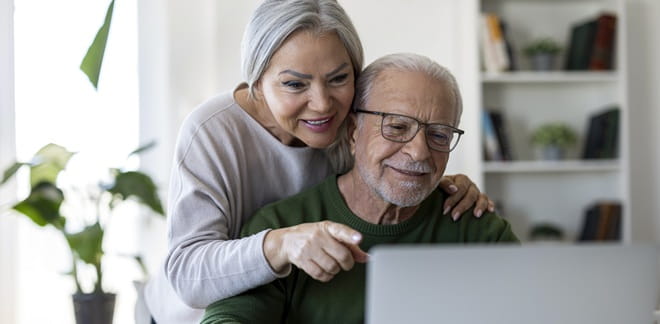 Couple looking at a laptop