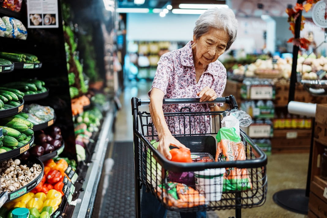 A woman grocery shopping