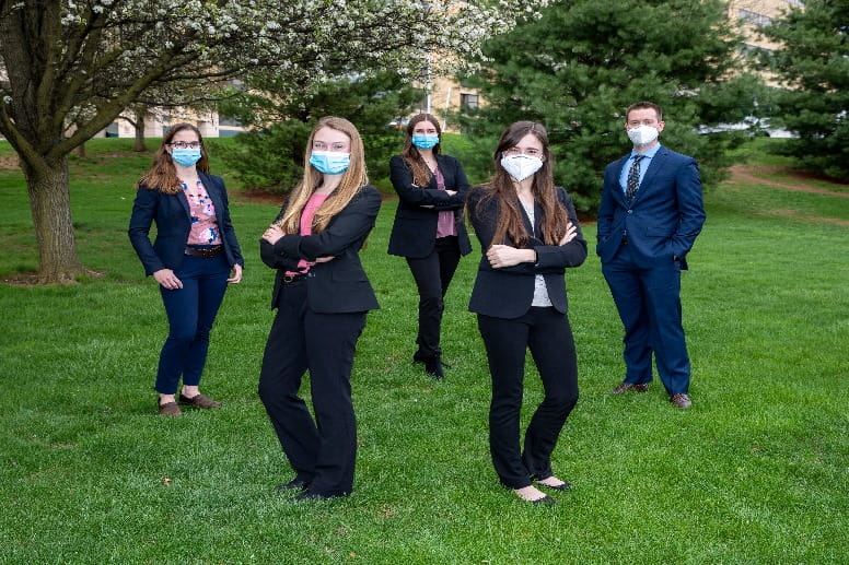 Students posing at graduation