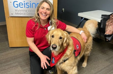 a Geisinger volunteer with a therapy dog