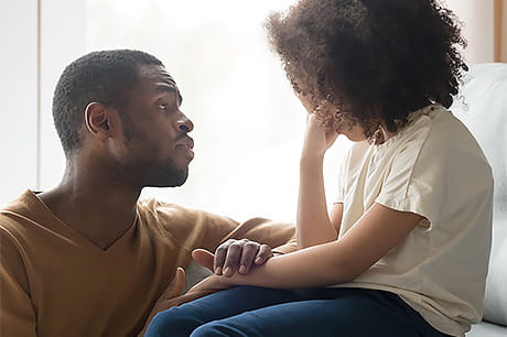 Father talking to daughter about child abuse