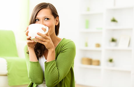 A woman drinking coffee