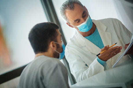 A man talking to a doctor