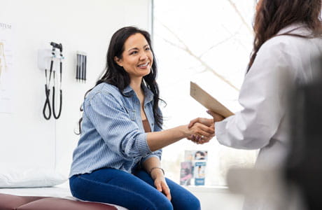 A woman talking to her doctor