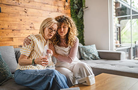 Daughter taking care of sick mother