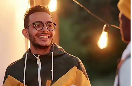 Young man talking seriously to a friend or family member