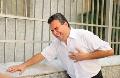 Man clutching his chest in pain