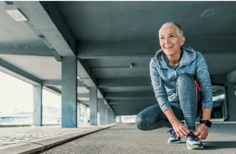 Runner lacing up their sneakers