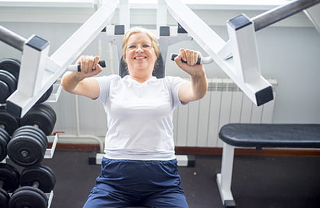 A woman working out after having bariatric surgery