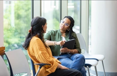 A woman speaking with her counselor
