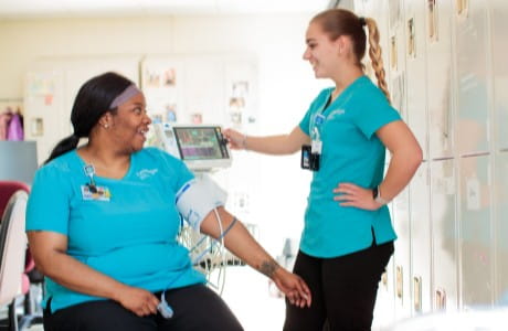 Patient Care Technicians checking blood pressure