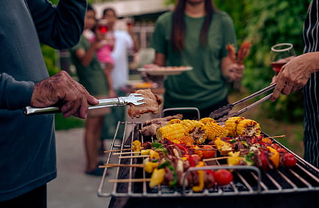 People grilling healthy vegetables