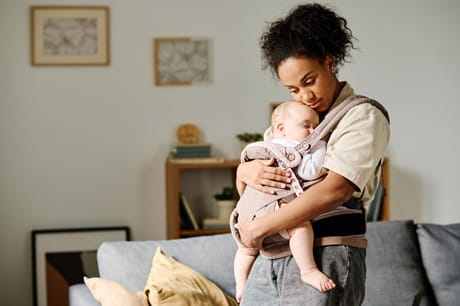 A woman holding her baby