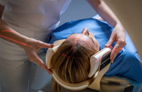 Female patient receiving radiation therapy