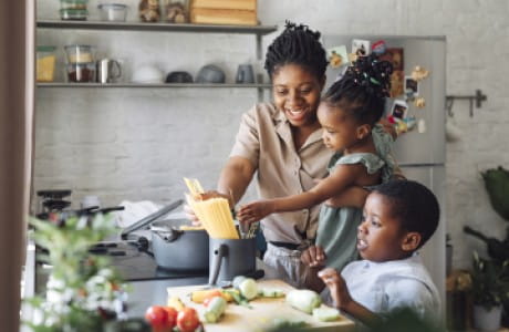Mother and children preparing a healthy meal