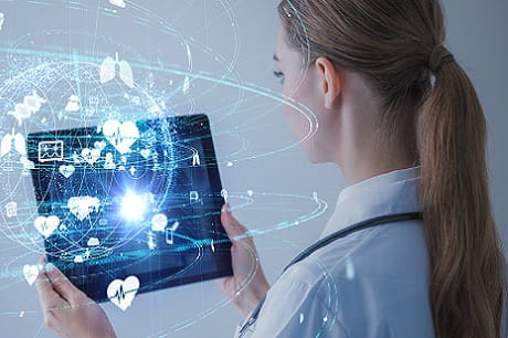 Doctor viewing a computer tablet