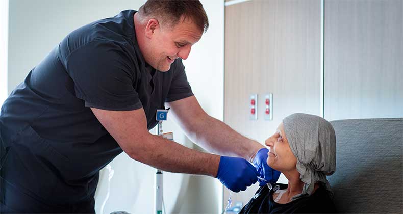 Cancer patient being helped by Geisinger nurse
