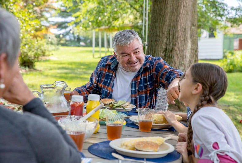 A family eating outside.