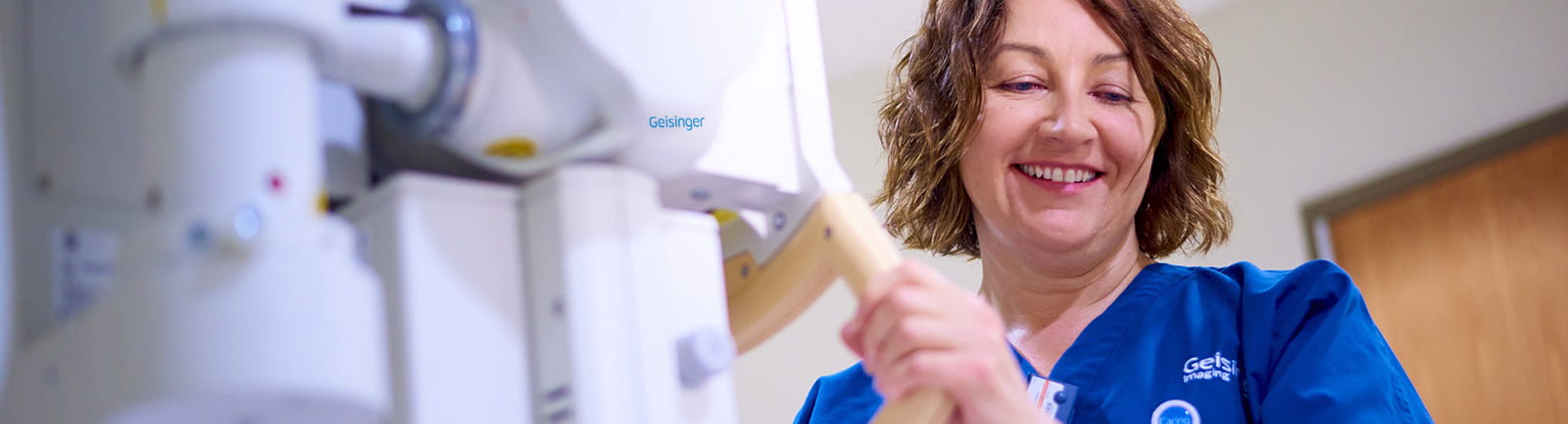 Nurse wheeling in imaging machine