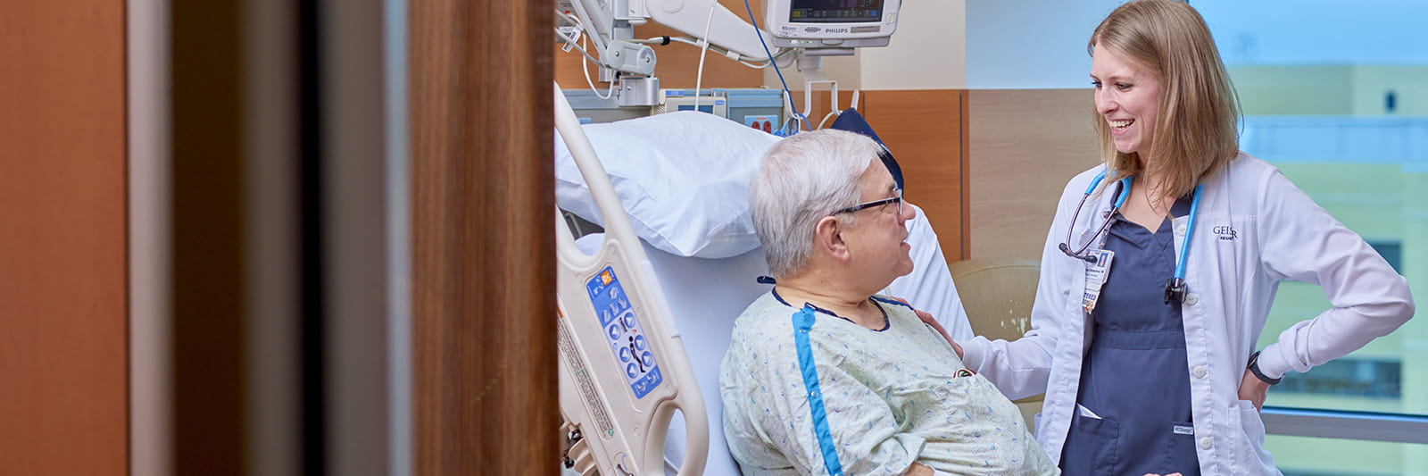 Dr. touching patient's shoulder