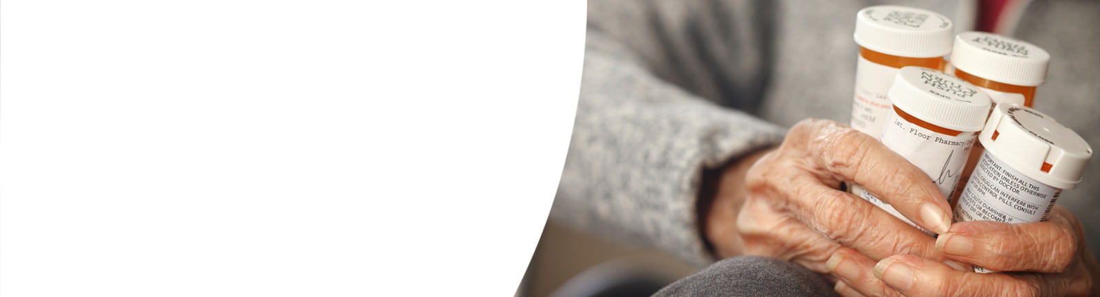 Hands holding prescription medications