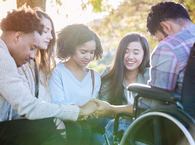 A group of people praying.