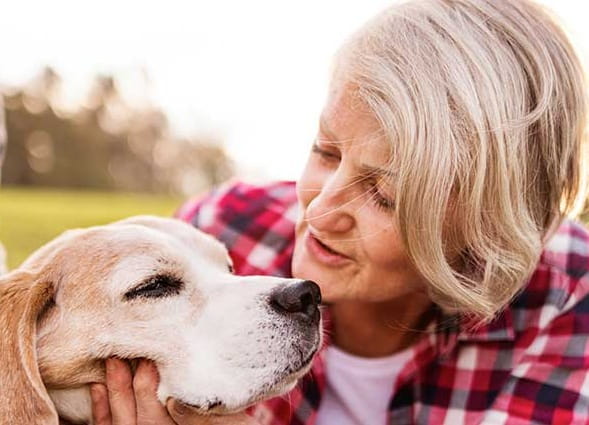 A senior woman with a dog