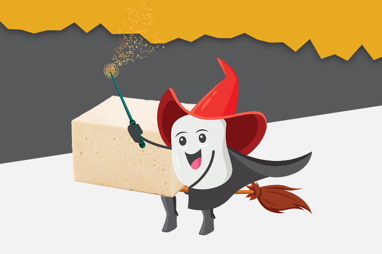 Animated tofu character with a broom sweeping near a block of tofu, on a gray and orange background.