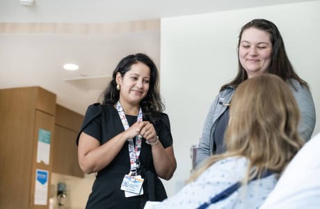 A Geisinger Interpreter works with a patient