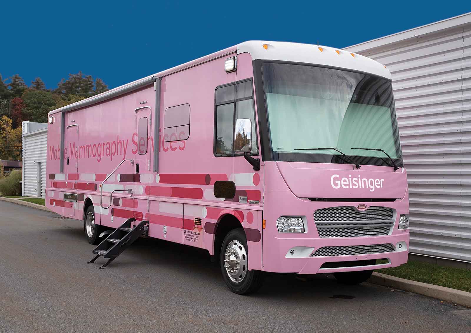 A pink Geisinger bus offers mobile mammography services for rural patients.