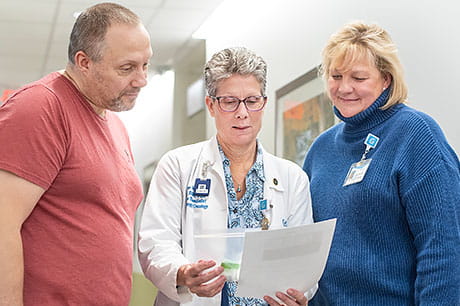 Patient Paul Wasavage talks with Ann Webster and Jenifer Olszyk.